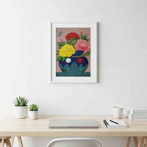 Art print of a bokjumeoni adorned with traditional motifs inspired by Korean folk art holding a bouquet of colorful peonies with a butterfly floating in the corner, representing good fortune, harmony and joy, on a wall above a desk with office supplies.