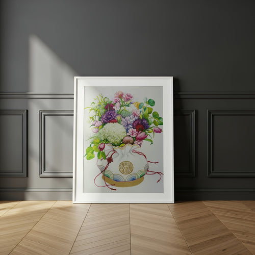 Framed wall art of a Korean coin pouch with a bouquet of flowers, which symbolizes celebrates luck, good health, and fortune, on a dark wall.