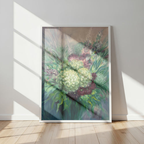 Framed impressionism-style floral art print on a wall with sunlight casting shadows.