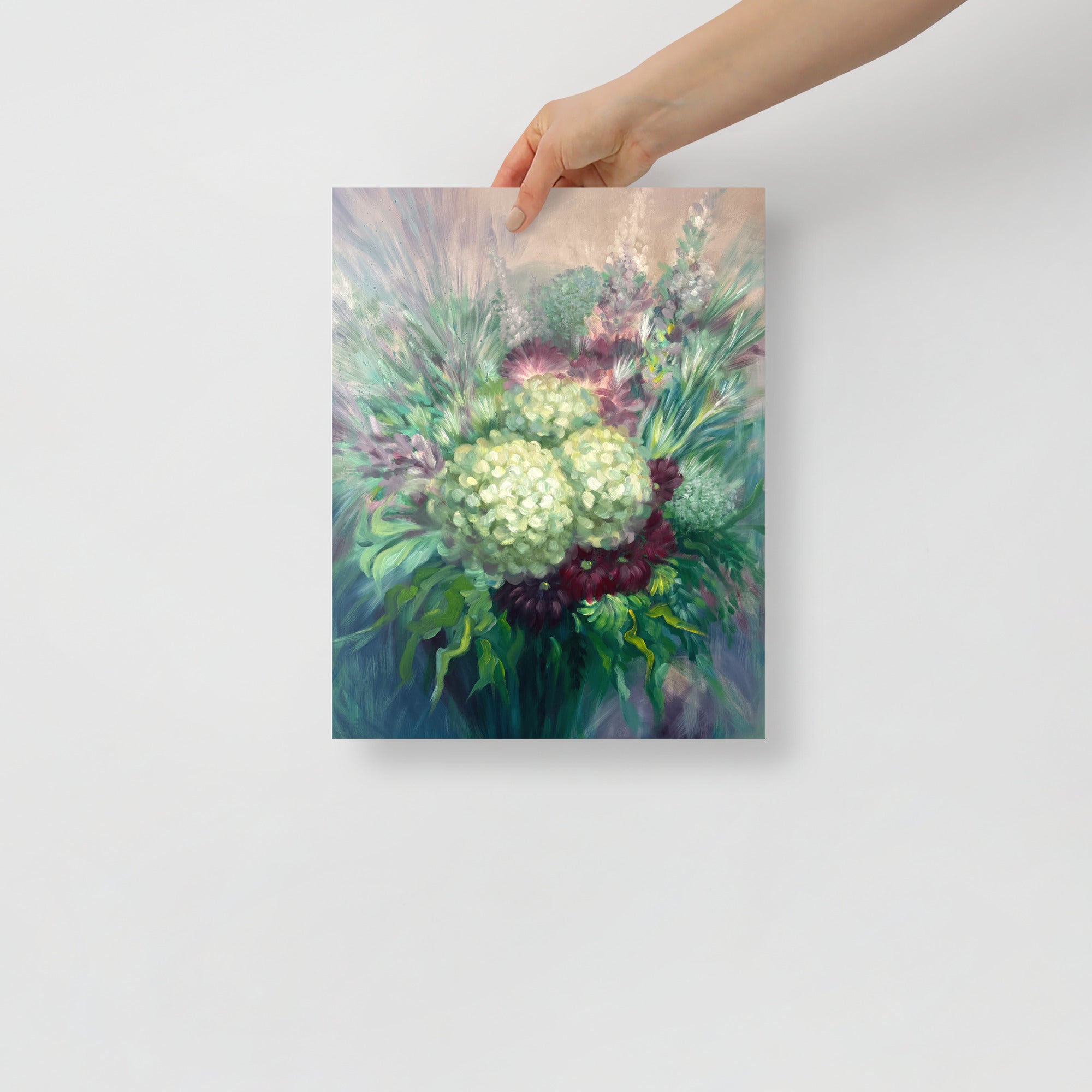 Hand holding a 11x14 inch floral art print on a white background.