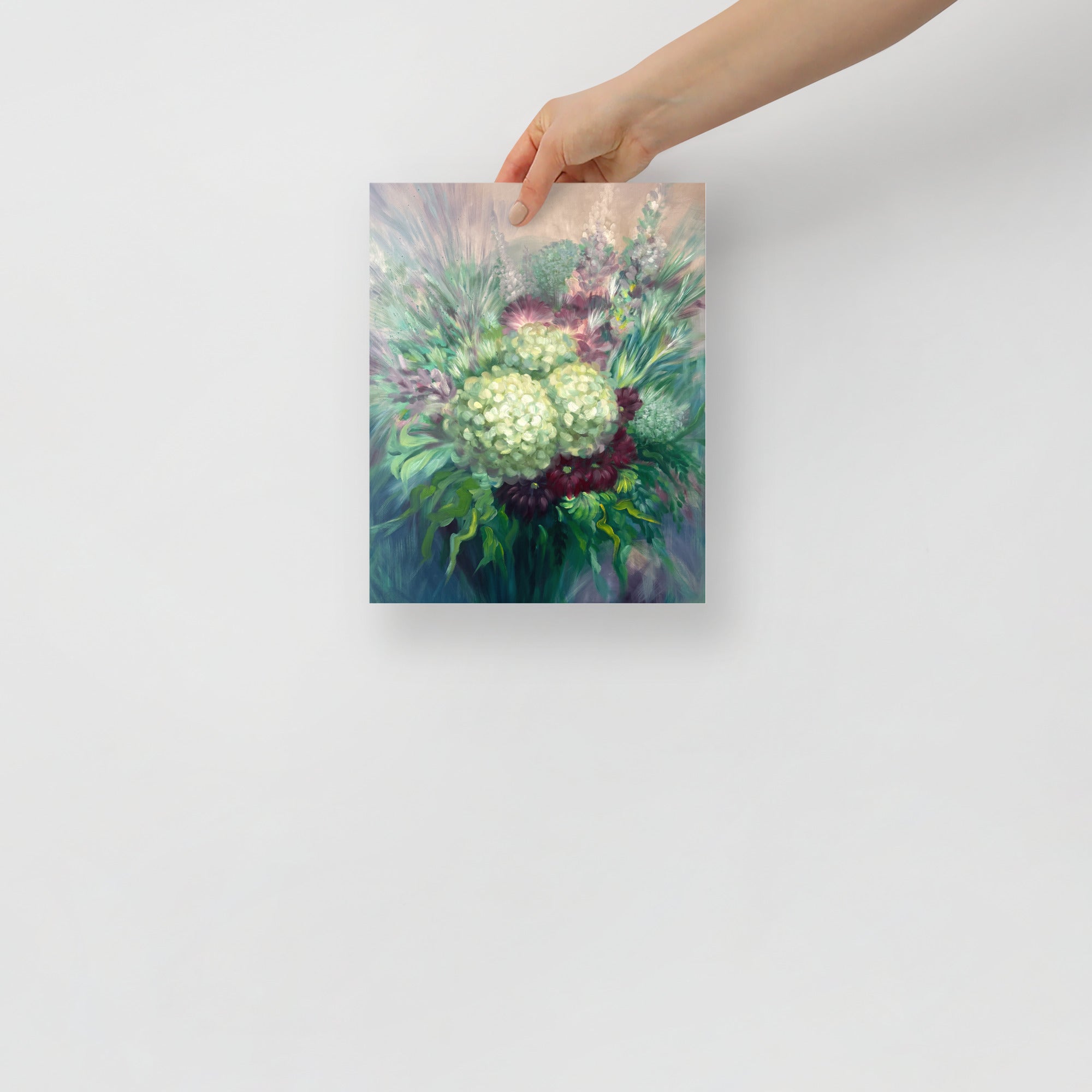Hand holding a 8x10 inch floral art print on a white background.