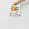 Hand holding an art print with a colorful floral design inspired by Korean folk art on a white background (10x10 size).